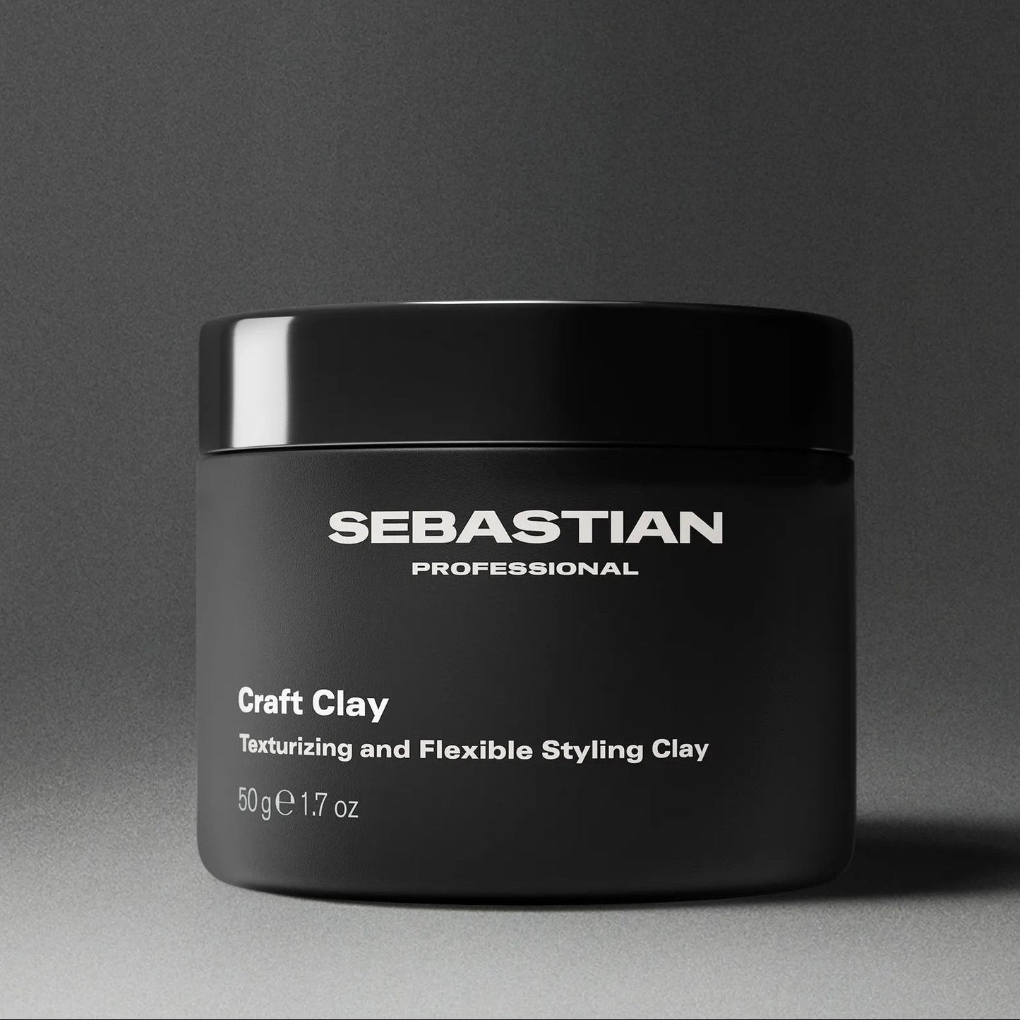 Black jar of Sebastian Professional Craft Clay on a gray background