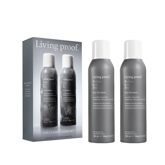 Living Proof The Classic Clean Set, featuring a gray packaging box and two gray aerosol cans with white caps, shown on a plain white background.