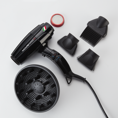 Black hair dryer with attachments on a white background