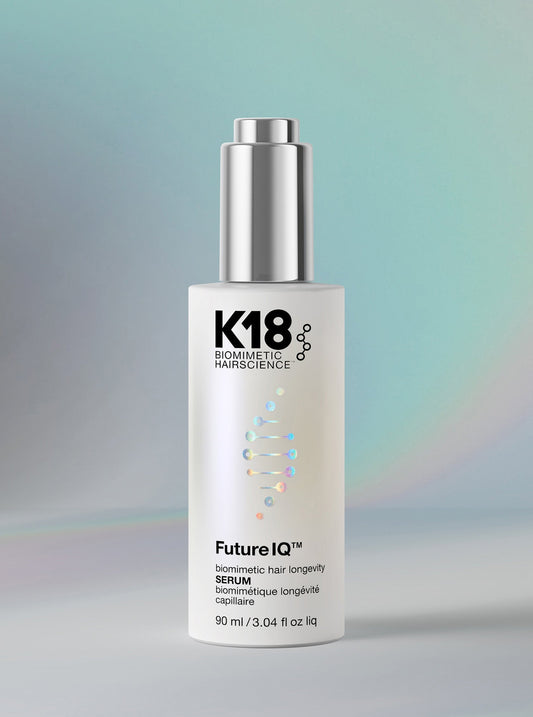 K18 biomimetic hair science serum bottle on a gradient background
