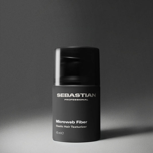 Black container of Sebastian Professional Microweb Fiber on a gray background